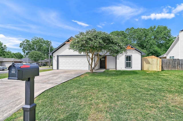 view of front of home with a garage and a front lawn