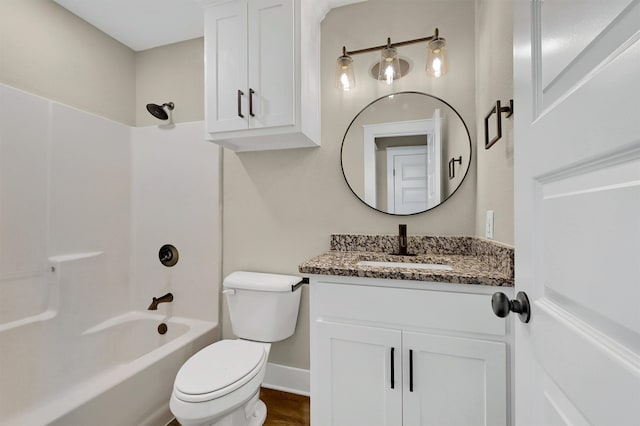 full bathroom featuring toilet, shower / bathing tub combination, and vanity