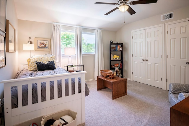 carpeted bedroom with ceiling fan