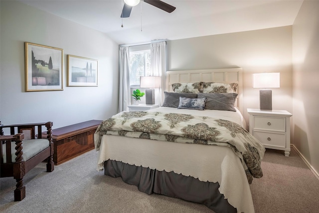 bedroom with ceiling fan, lofted ceiling, and light carpet