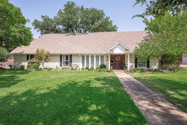 ranch-style house with a front lawn