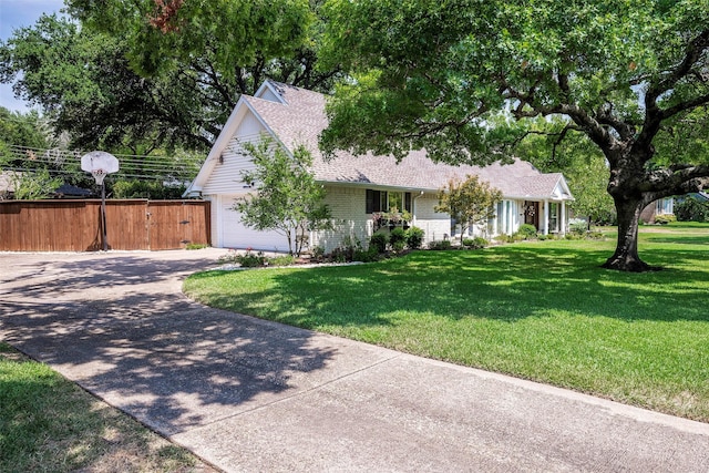 single story home with a front yard and a garage