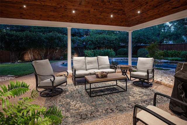 view of patio / terrace with a fenced in pool and an outdoor living space