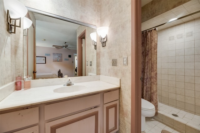 bathroom featuring tile patterned flooring, vanity, toilet, and curtained shower