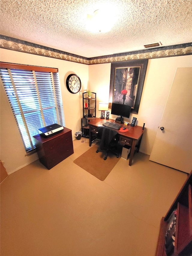 office featuring carpet flooring and a textured ceiling