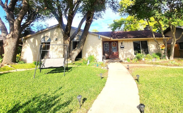 ranch-style house with a front lawn