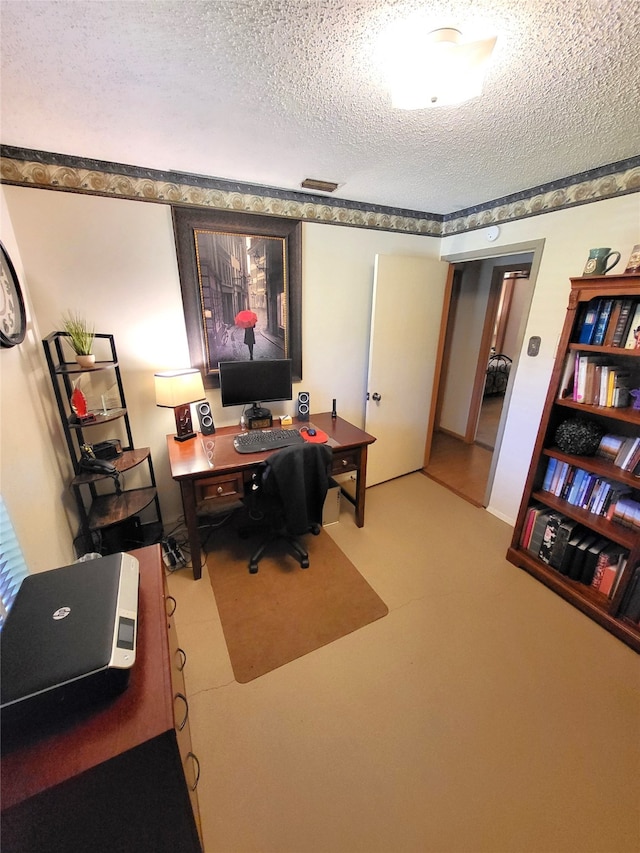 home office with a textured ceiling