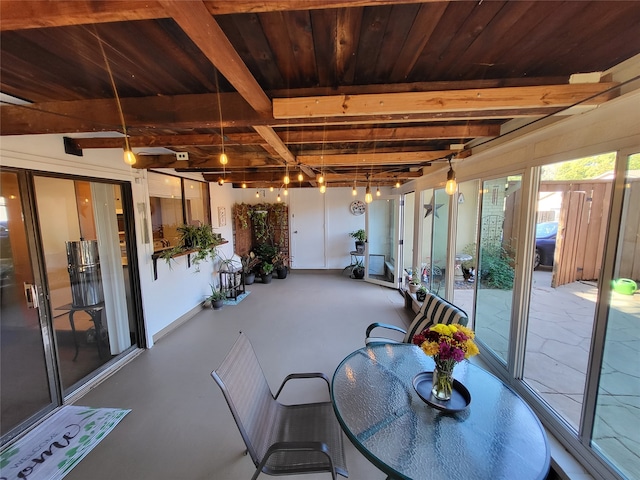 sunroom / solarium with beamed ceiling and wooden ceiling