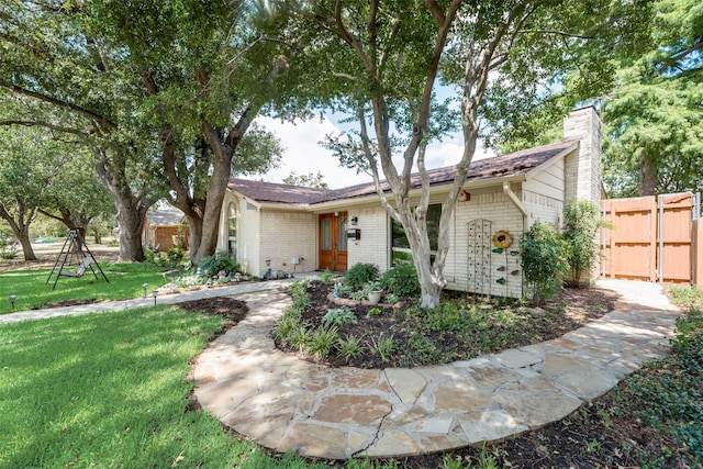 view of front of property with a front lawn