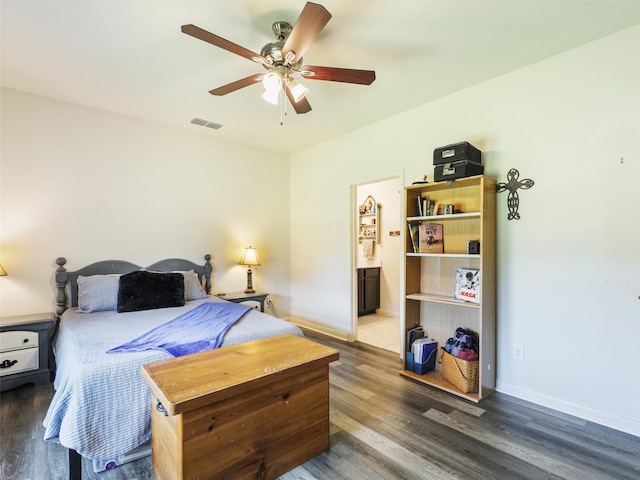 bedroom featuring ceiling fan, ensuite bathroom, and hardwood / wood-style flooring