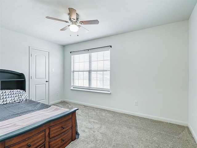 bedroom with ceiling fan and light colored carpet