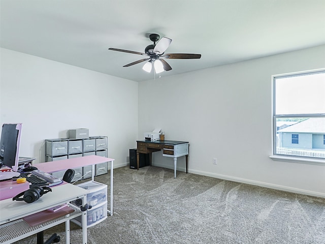 carpeted home office with ceiling fan