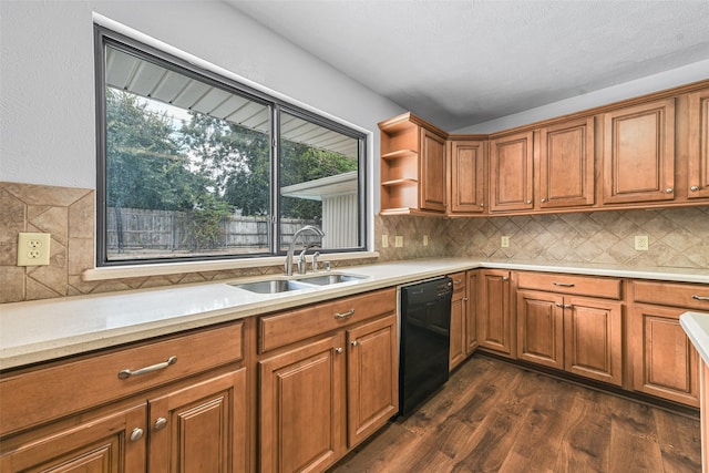 kitchen featuring dishwasher, dark wood-type flooring, tasteful backsplash, and sink