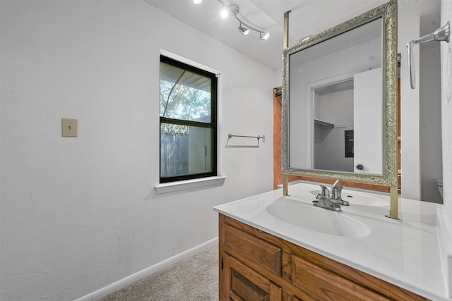 bathroom with toilet and vanity