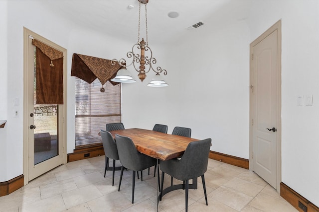 dining room with baseboards and visible vents