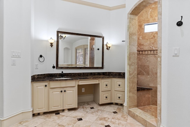 bathroom featuring ornamental molding, a walk in shower, and vanity