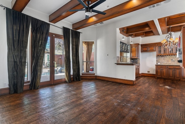 unfurnished living room with baseboards, visible vents, dark wood-style flooring, and french doors