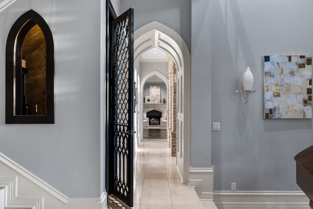 hall with light tile patterned floors