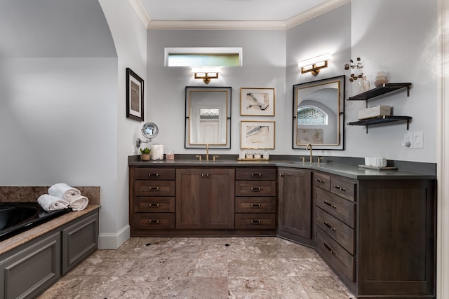 bathroom with a washtub, vanity, and crown molding