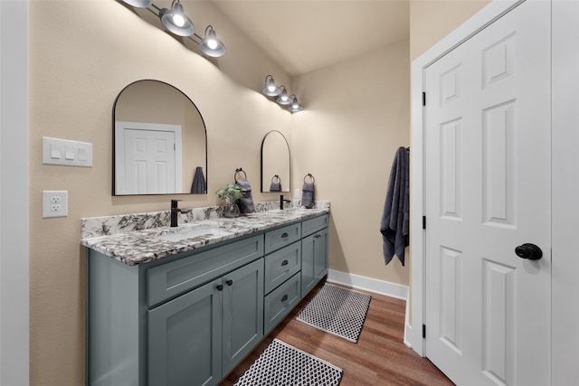 bathroom featuring vanity and hardwood / wood-style flooring