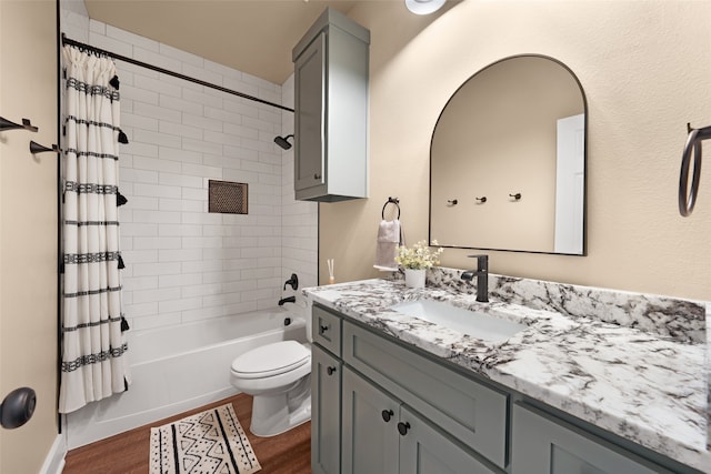 full bathroom with vanity, toilet, hardwood / wood-style flooring, and shower / bath combination with curtain