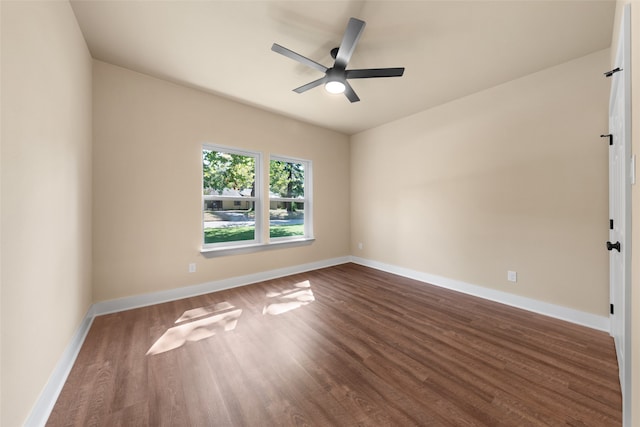 empty room with hardwood / wood-style floors and ceiling fan