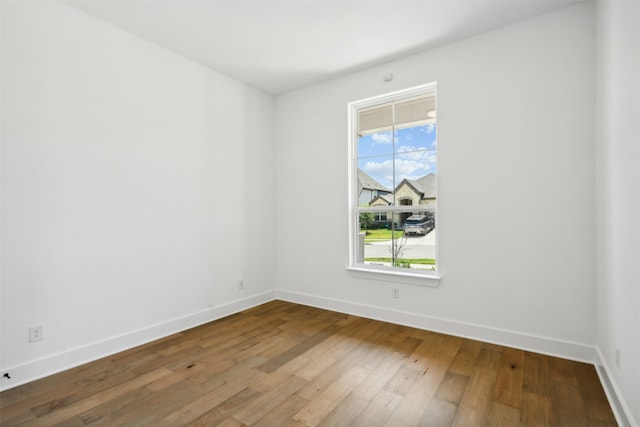 spare room featuring hardwood / wood-style flooring