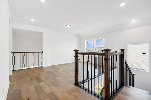 hall with wood-type flooring