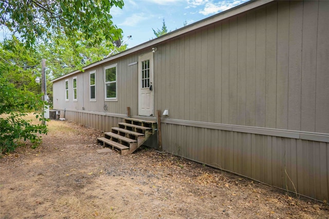 back of property with central air condition unit