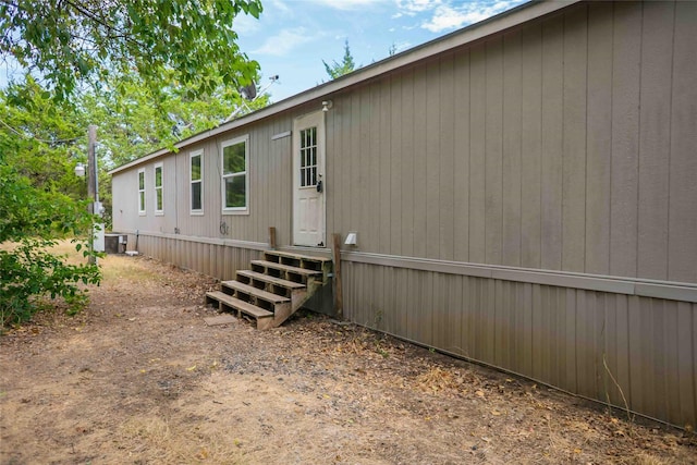 view of side of home featuring central air condition unit
