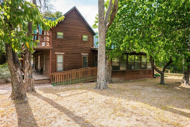 view of side of property featuring a deck