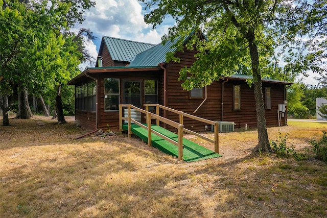 back of property featuring a sunroom