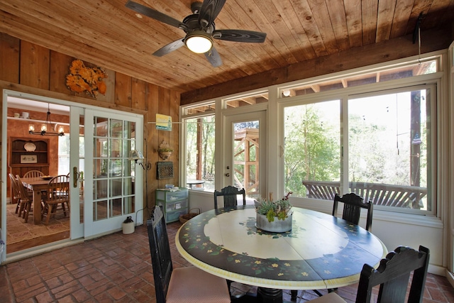 sunroom / solarium with wood ceiling and ceiling fan with notable chandelier