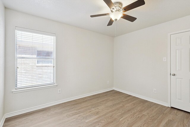 unfurnished room featuring ceiling fan and light hardwood / wood-style floors