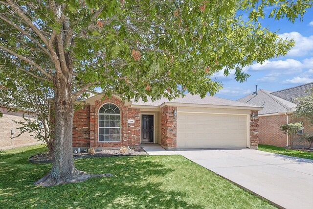 view of front of home with a garage and a front lawn