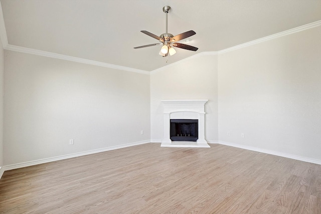 unfurnished living room with crown molding, ceiling fan, and light hardwood / wood-style floors