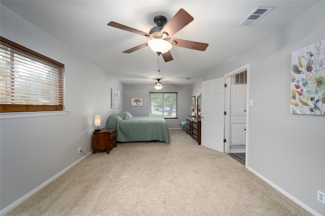 carpeted bedroom with ceiling fan