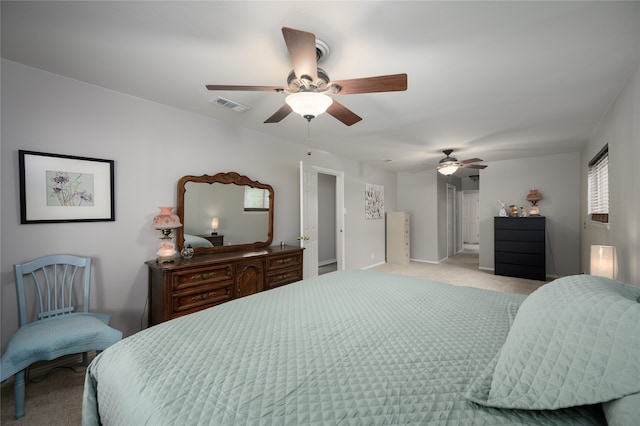 bedroom with ceiling fan and light colored carpet