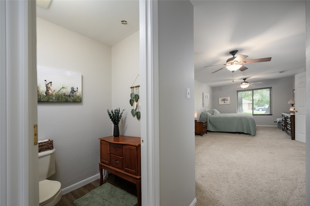 bedroom with ceiling fan and carpet floors