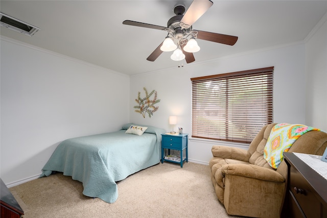 bedroom featuring ceiling fan, light colored carpet, and crown molding