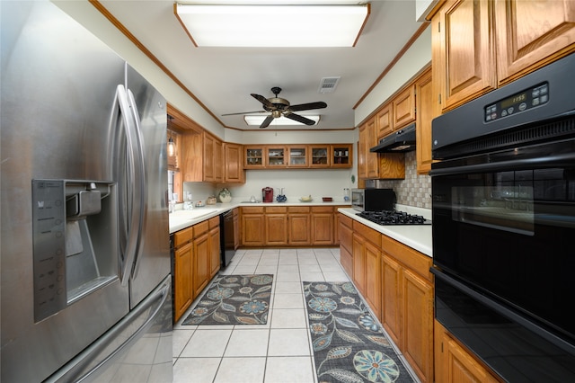 kitchen featuring tasteful backsplash, ceiling fan, crown molding, black appliances, and light tile patterned floors