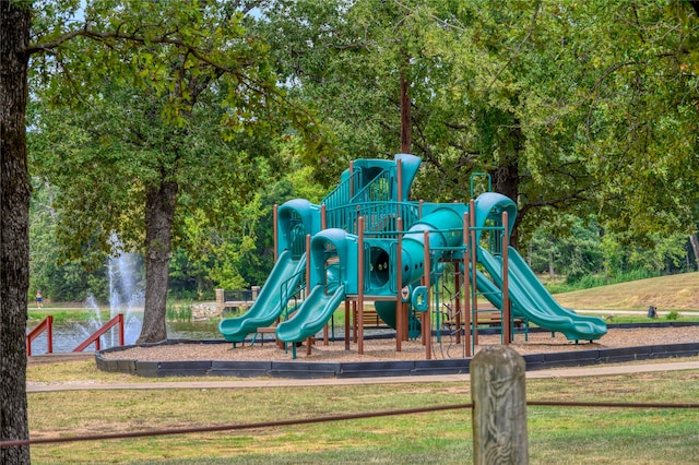 view of playground with a lawn