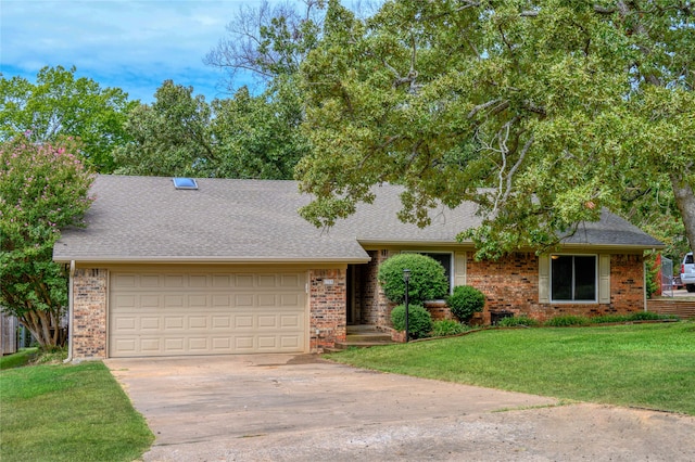 view of front of house with a front yard and a garage