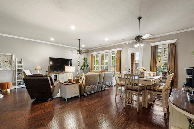 dining room with a textured ceiling, ceiling fan, ornamental molding, and dark hardwood / wood-style flooring