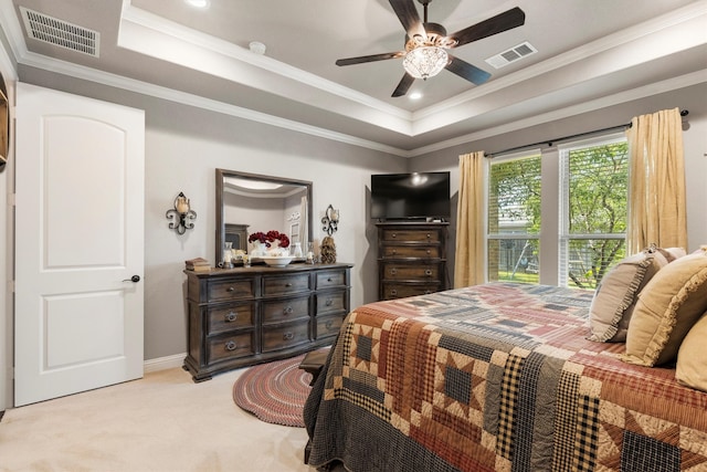 carpeted bedroom with crown molding, a raised ceiling, and ceiling fan