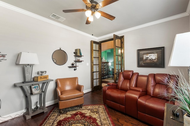 living room with ceiling fan, dark hardwood / wood-style flooring, crown molding, and french doors