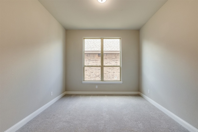 empty room with light colored carpet