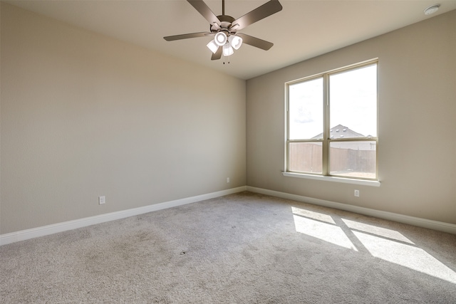 empty room with ceiling fan and light colored carpet