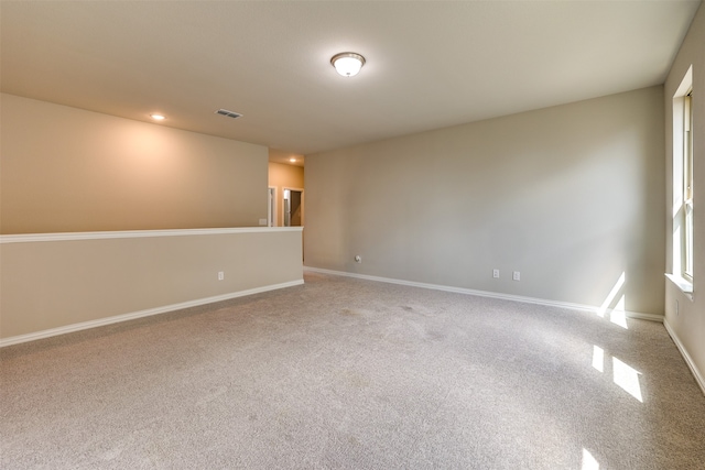 unfurnished room with carpet floors