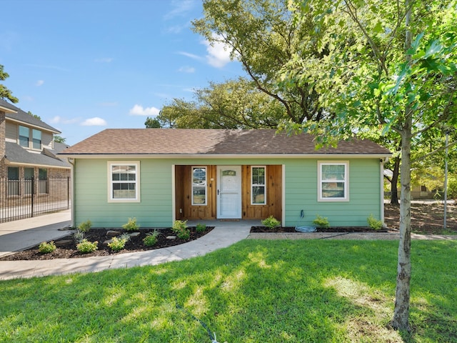 single story home with a front yard